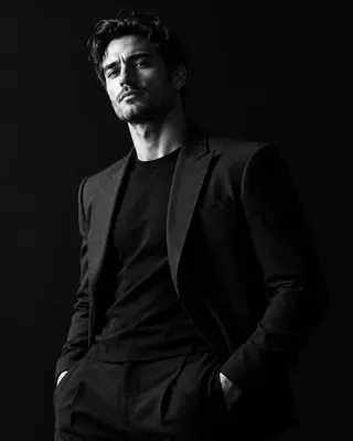 Sample photo: High-contrast black-and-white fashion portrait. Generated stand-in.